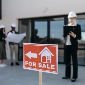 Red For Sale Sign by House